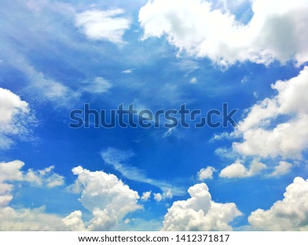 Big white fluffy clouds in the blue sky and blue sky with cloud close up.