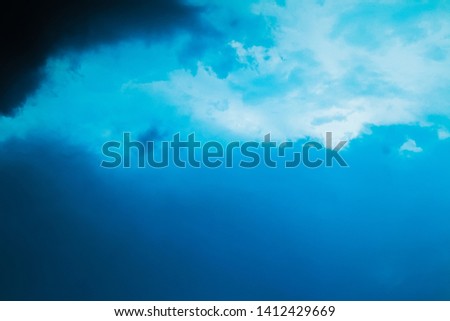 The beautiful blue clouds shine before the rainstorm comes. 
Gradation of the sky from the bright part to the dark part for texture background.
