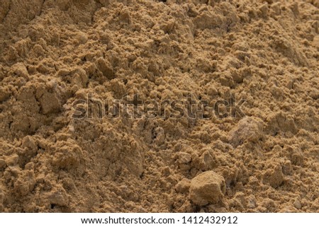 river sand poured on the ground