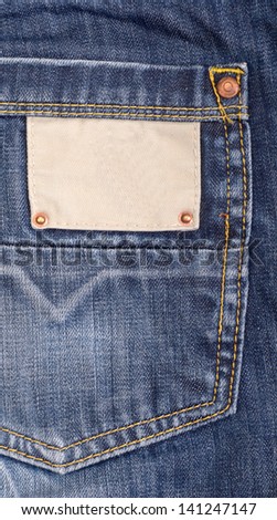 Blank cloth jeans label sewed on a blue jeans