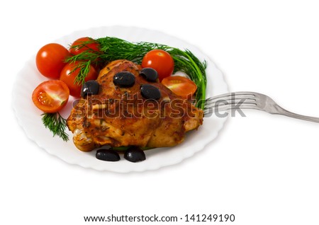 Chicken thighs with spices, olives, cherry tomatoes and fennel in a plate. Isolated on a white background.