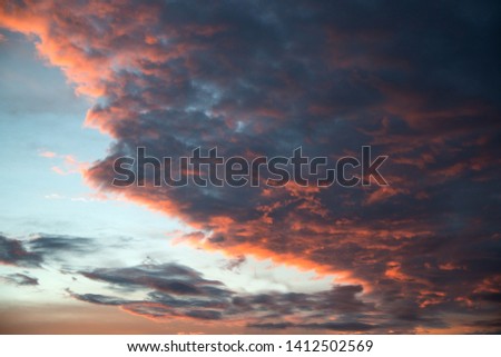 Dramatic and beautiful pink and blue sky and clouds abstract background of art picture of orange clouds texture.   