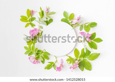 Mockup round white frame with pink flowers on white background