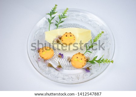 Cute Pineapple cookies  colorful cartoon characters on the plate. On a white background