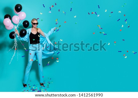Beautiful happy girl with balloons and confetti. birthday party. Studio shot. - Image  