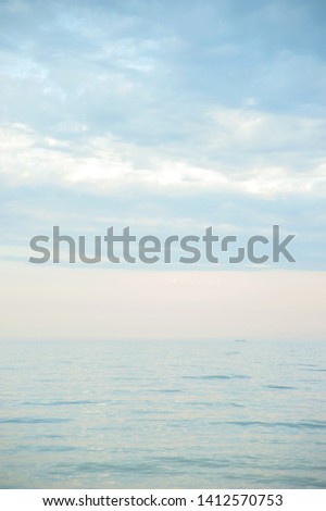Seascape with sea horizon and blue sky. Background. Painterly seascape scene with relaxing sunset colours