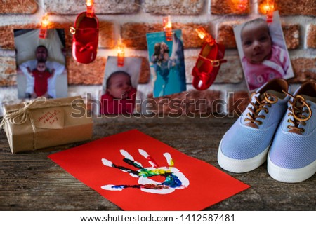 Happy Father’s Day . Pictures, gifts and string lights on the wooden rustic table ( Father’s Day concept )