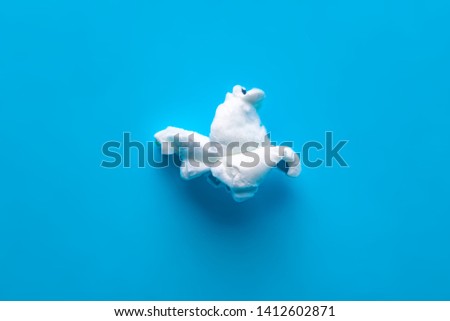 Popcorn on a blue background. Macro image of popcorn