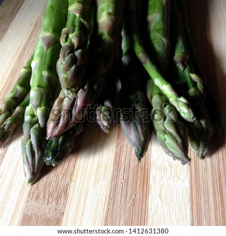 Macro Photo food vegetable asparagus. Texture background of green fresh asparagus sticks. Image of product vegetable stems of green asparagus