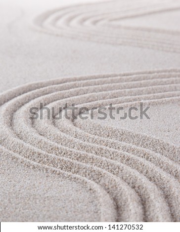zen stone in the sand