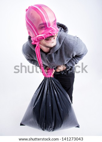 funny thief with pink tights on his face holding a stolen bag