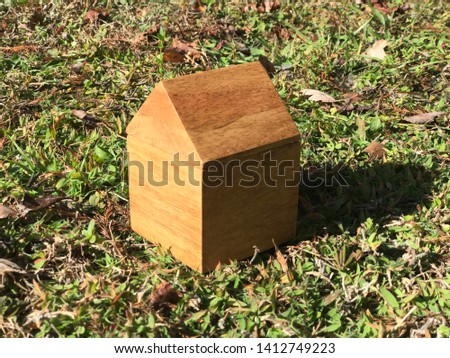 Little Wood House in grass. Photo image