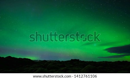 Northern lights shimmer in light green