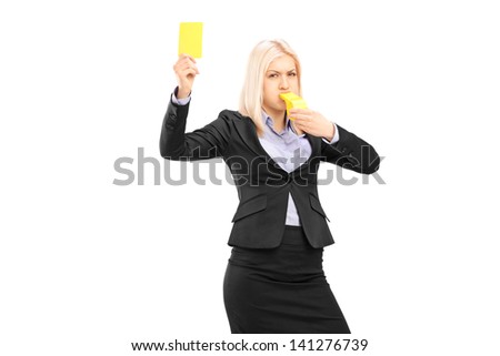 Angry businesswoman blowing a whistle and showing a yellow card, isolated on white background
