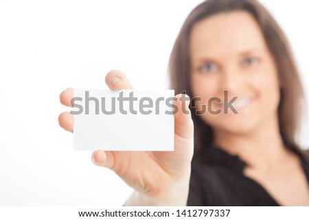 office female holding up blank business card on white background 