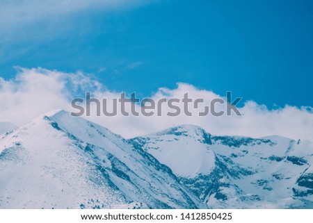 High alpine Himalayan mountain snow peak landscape, beautiful natural winter backdrop. Ice hill top, cloudy sky background.