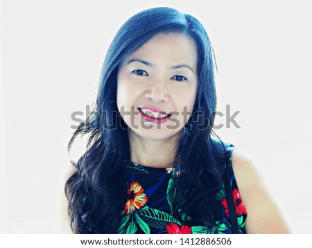 Close up on good looking Asian woman with smiling face on white background.