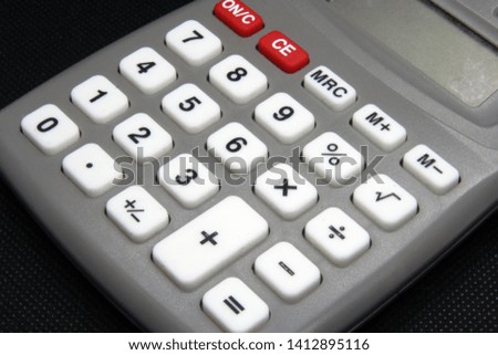 Vintage calculating tool. Calculator office tool. Old calculator.