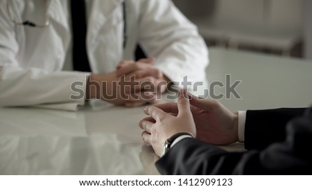 Person in suit at urologist appointment, private treatment of male diseases Royalty-Free Stock Photo #1412909123