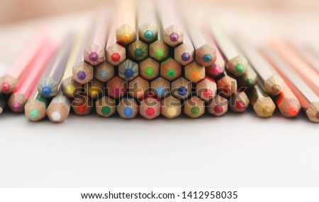 Multicolored Pencils on white background.