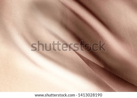 brown transparent fabric with large folds, textile background