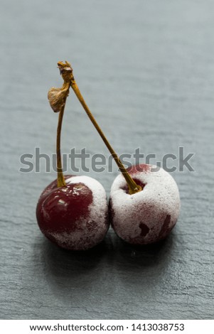 Group Of Frozen Cherries on a dark background Close Up. 