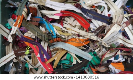 many colorful zippers for tailoring, sewing