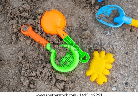 Colorful baby sand toys on the beach