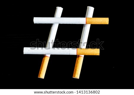 Pile cigarette on black background, cigarette hashtag