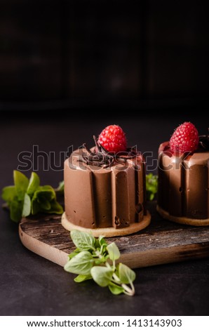 Delicious dessert with dark chocolate and fresh raspberry inside