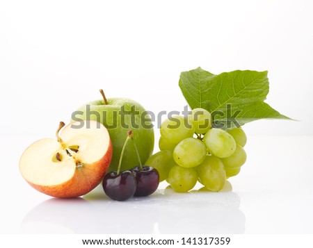 Various, assorted fruits (grape, apple, cherry, green apple) with leaf, isolated on the white background with soft shadow