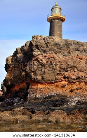 Strata of colors in cliff, lighthouse tip of Jandia, coast of Fuerteventura, Canary islands