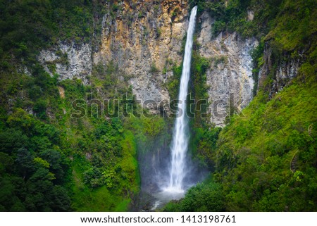 Sipiso-piso waterfall famous travel destination natural landmark and tourist attraction in Berastagi and Lake Toba, Sumatra Indonesia. Long exposure, vignetting.