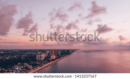Aerial view on Public Beach, coast line, Ocean and Fort Lauderdale City on a sunrise. Drone photography. Early morning.