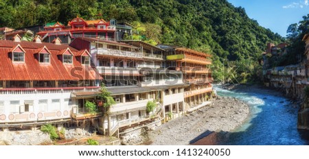 Old residential and business building built along side a river valley in Wulai, Taiwan.