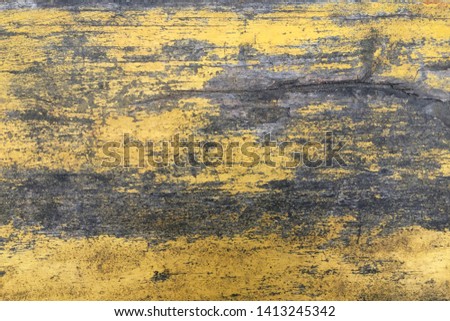 The surface of the old wooden texture painted in yellow. Can be used as a background or in the interior.
