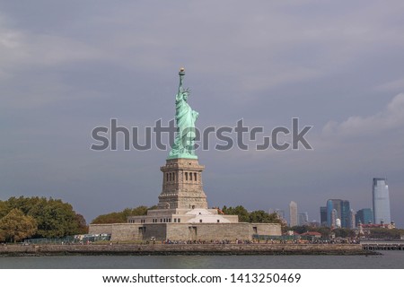 Beautiful view of famous Statue of Liberty and Manhattan on background.  Liberty Island in New York Harbor in New York. 