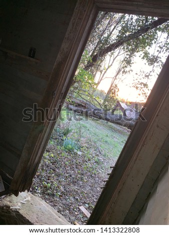 Abandoned location doorway picture with sunset