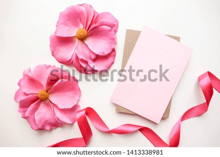 greeting card design. pink flowers on a pink background and envelope