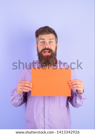 Surprised bearded man holding advertising board. Advertising and sale. Online shopping. Advertising banner. Seasons sale. Discount. Add. Copy space for text. Purchase.
