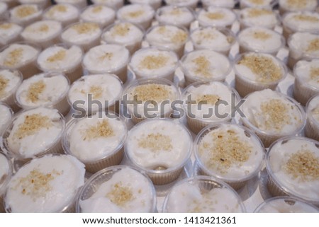 Close-up pictures of Thai dessert cups, put a lot of coconut milk on the table, catering concept  Select some focus
