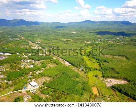 over view image from drone flight  over countryside at southern Thailand background.