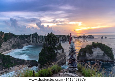 Early morning sunrise with Vew of cliff Nusa Penida Island, Bali, Indonesia. Azure beach, rocky mountains in ocean 