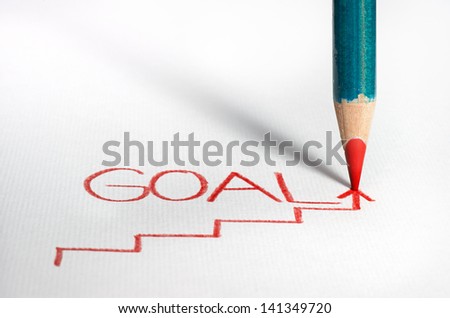Pastel pencil writing the word Goal