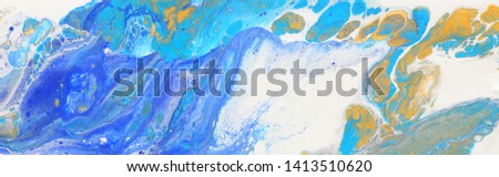photography of abstract marbleized effect background. Blue and white creative colors. Beautiful paint with the addition of gold. banner