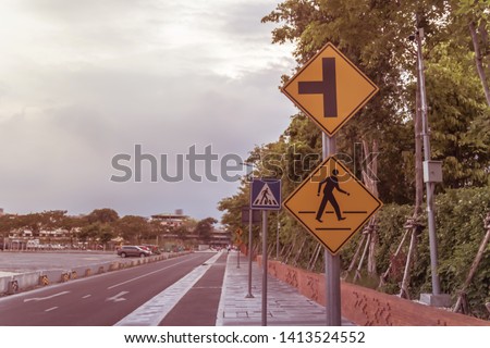 traffic signs on the sidewalk.