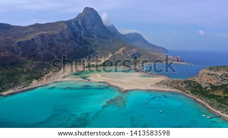 Aerial drone view of iconic Balos beach and lagoon near Gramvousa island with turquoise clear sea and pure white sand, Crete island, Greece