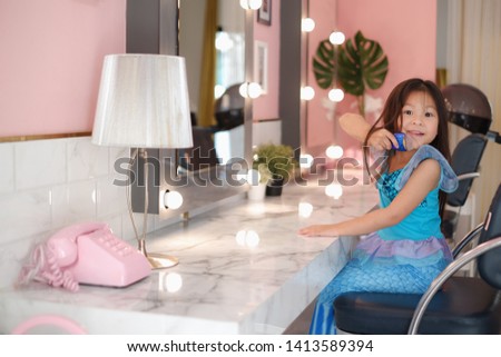 portrait asia little small girl in dressing room