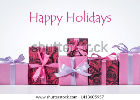 Gift box. Photos in fashionable style. Multi-colored boxes on white background. Front view. Modern photography in pop art style. Happy Holidays.