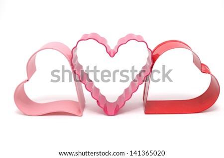 Metal cookie cutters, or biscuit cutters, in heart shapes isolated on white background. Is a tool to cut out cookies in a particular shape. This is special for Valentines day or romantic occasions.